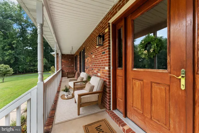 a view of entryway dining room and hall with wooden floor
