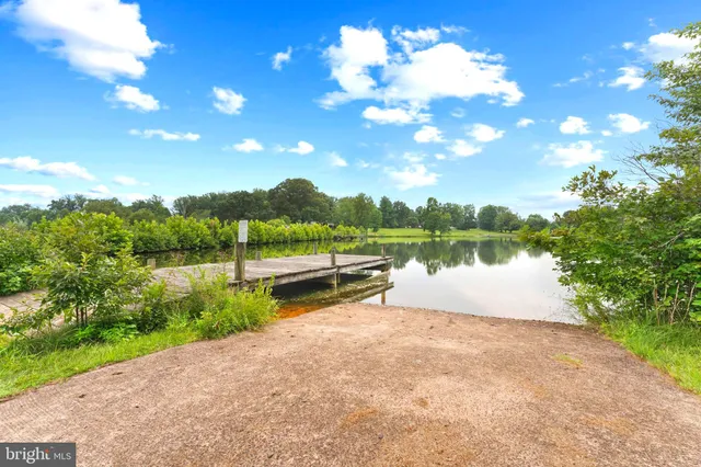 an entryway with wooden floor and stairs