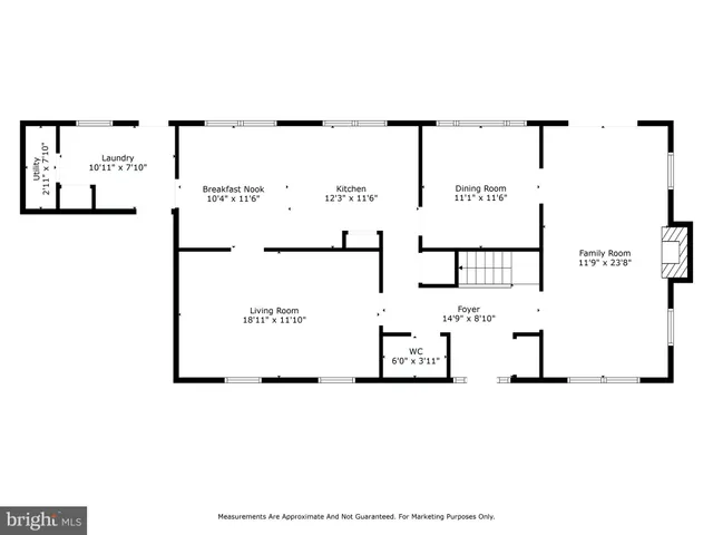 a view of a hallway with wooden floor and stairs