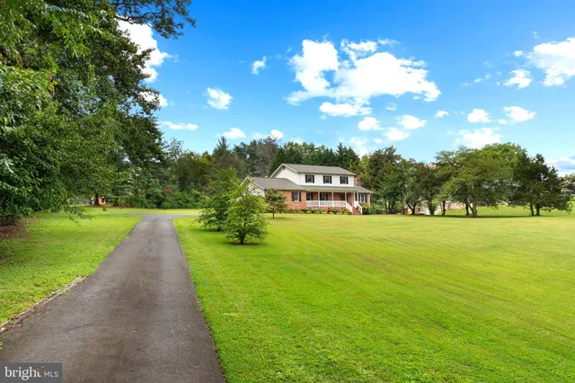 a view of an empty room and wooden floor