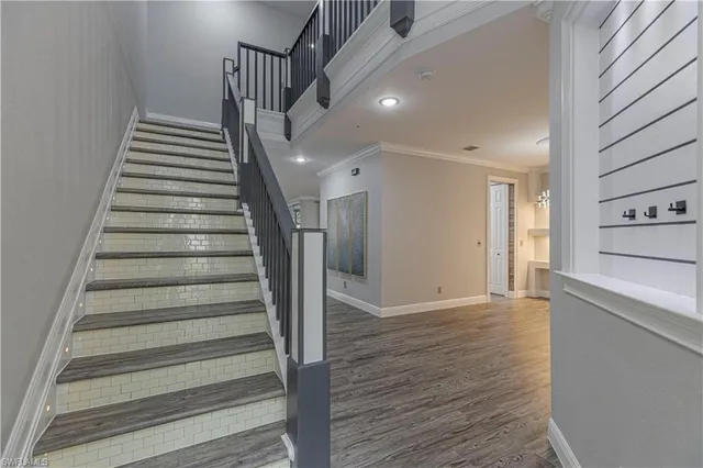 a view of an entryway with wooden floor
