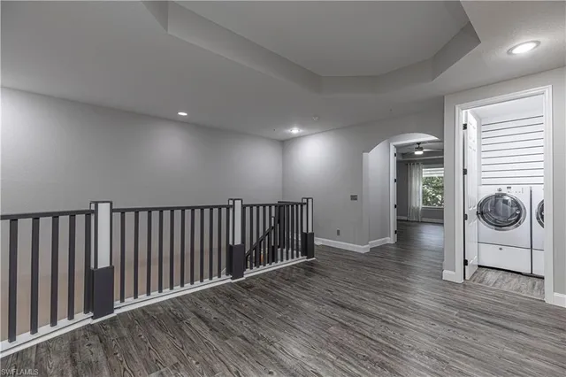 a view of hallway with wooden floor