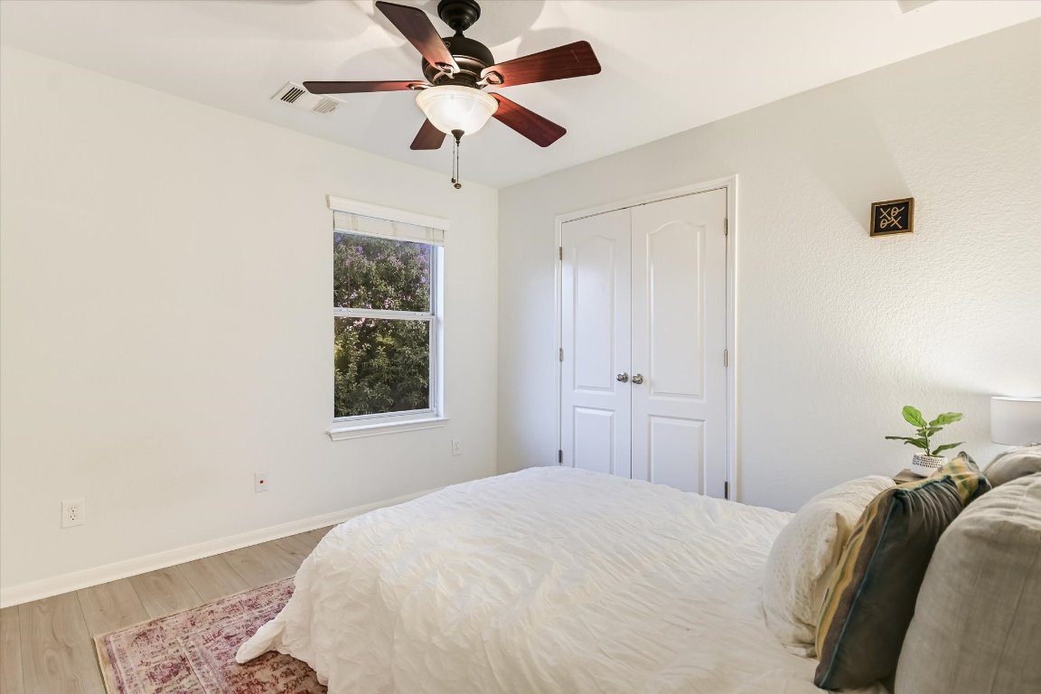 7711 Stephany Taylor Drive Austin, TX 78745 - Photo 14 of 23 a bedroom with a bed and a window