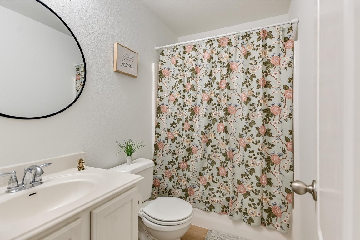 7711 Stephany Taylor Drive Austin, TX 78745 - Photo 15 of 23 a bathroom with a sink toilet and shower