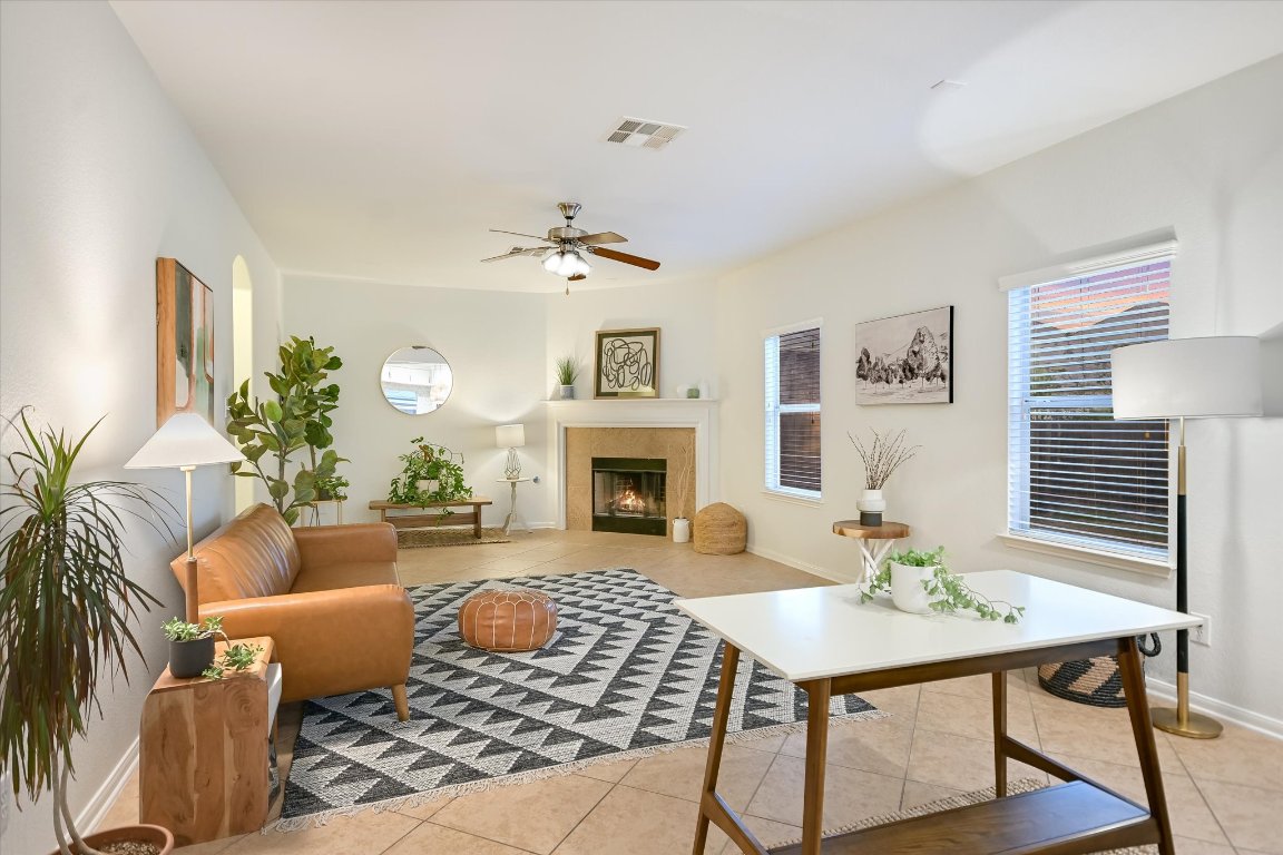 7711 Stephany Taylor Drive Austin, TX 78745 - Photo 7 of 23 a living room with furniture and a fireplace