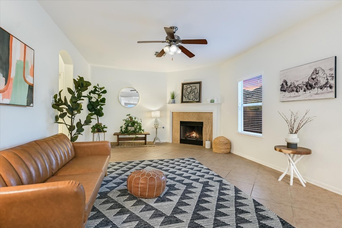 7711 Stephany Taylor Drive Austin, TX 78745 - Photo 9 of 23 a living room with furniture and a fireplace