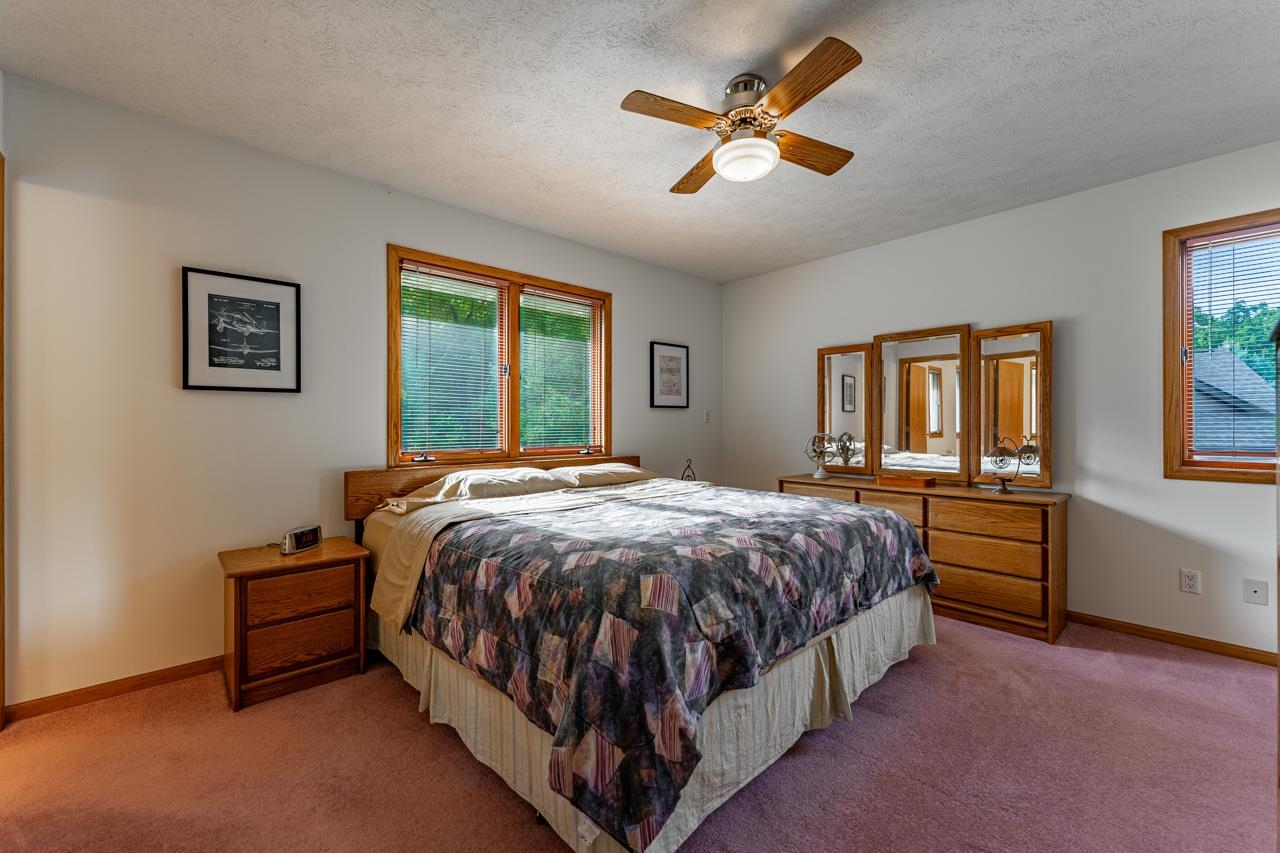 625 Waco Way Poplar Grove, IL 61065 - Photo 15 of 34 a bed sitting in a spacious bedroom next to a window