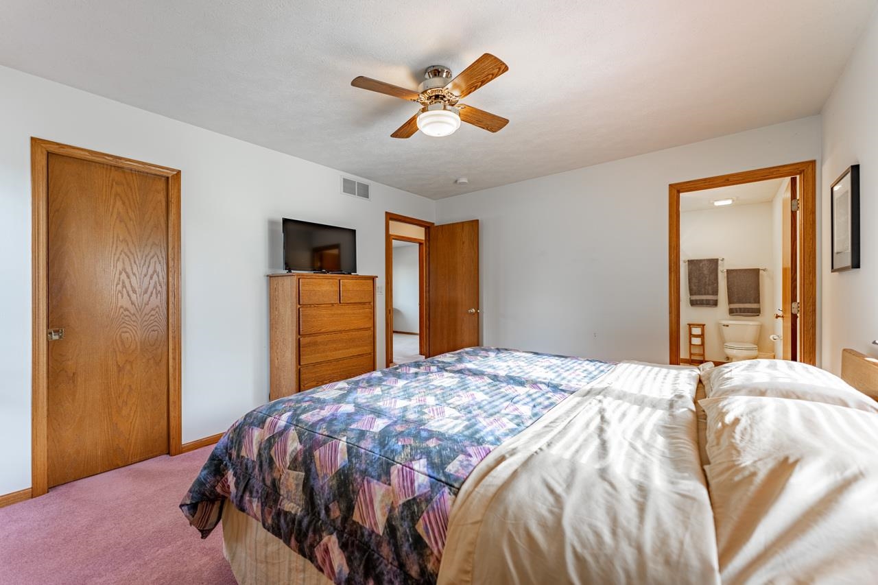 625 Waco Way Poplar Grove, IL 61065 - Photo 16 of 34 a bedroom with a bed and a dresser