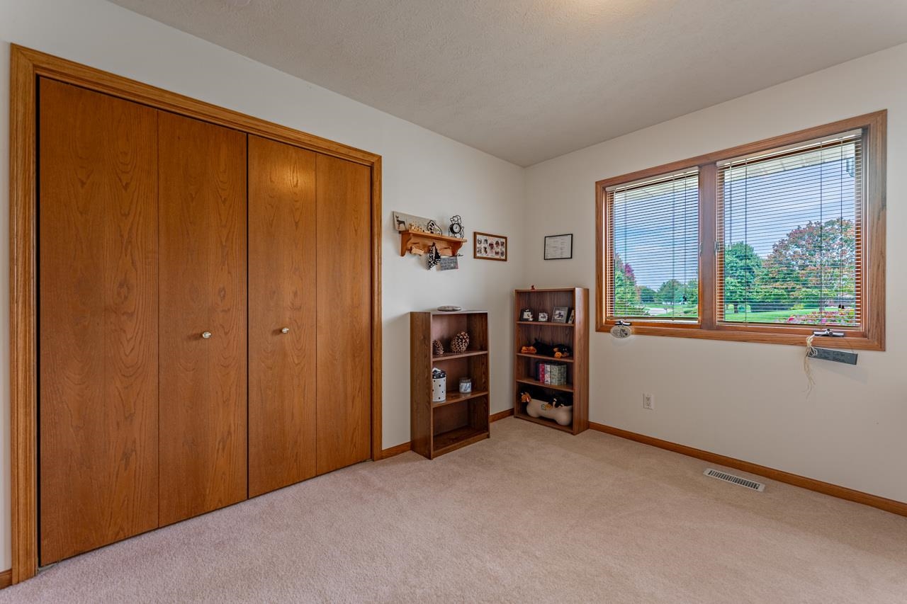 625 Waco Way Poplar Grove, IL 61065 - Photo 21 of 34 a view of an empty room with a window