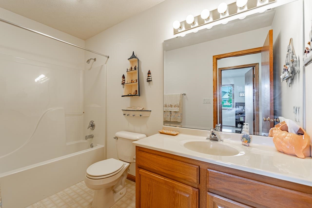 625 Waco Way Poplar Grove, IL 61065 - Photo 22 of 34 a bathroom with a sink a toilet and shower