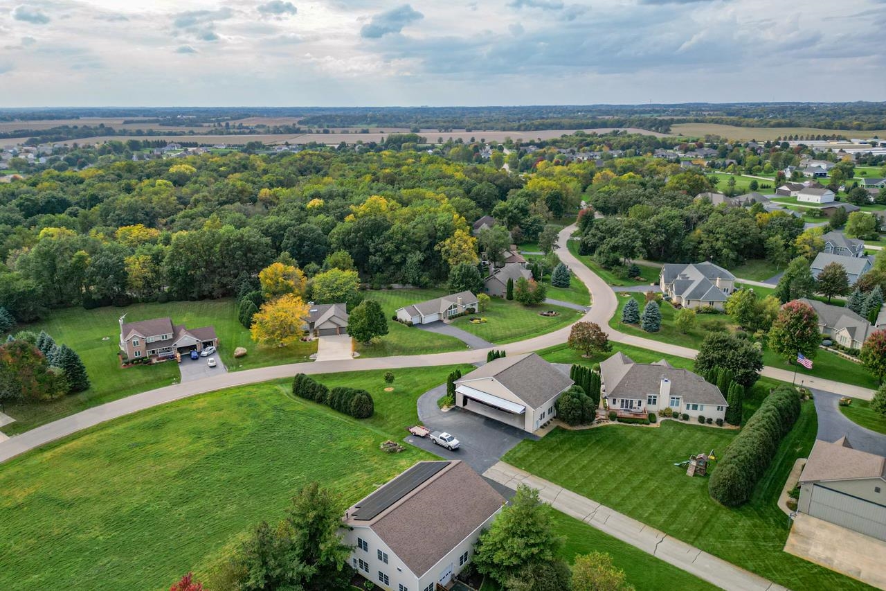 625 Waco Way Poplar Grove, IL 61065 - Photo 33 of 34 an aerial view of a house with a garden and trees