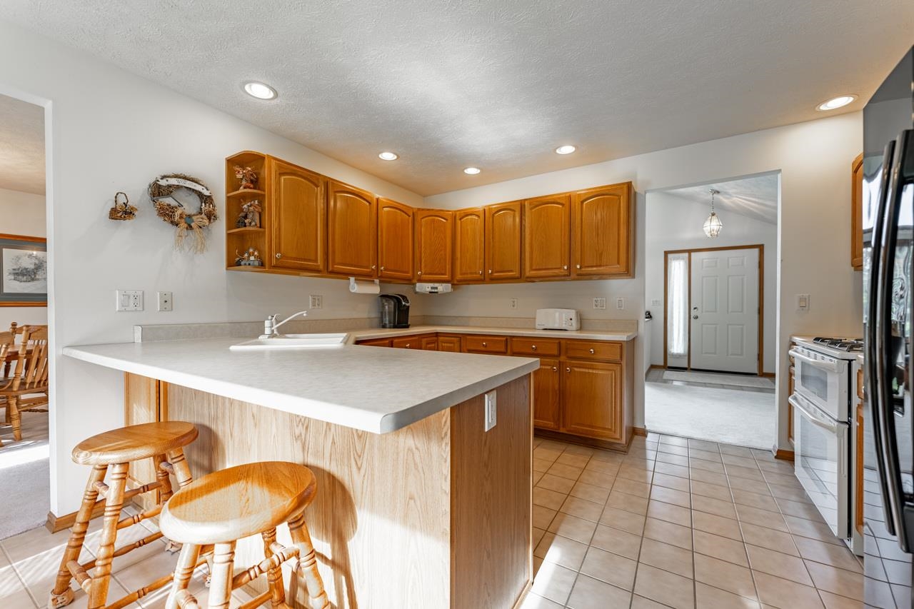 625 Waco Way Poplar Grove, IL 61065 - Photo 10 of 34 a kitchen with a sink appliances and cabinets