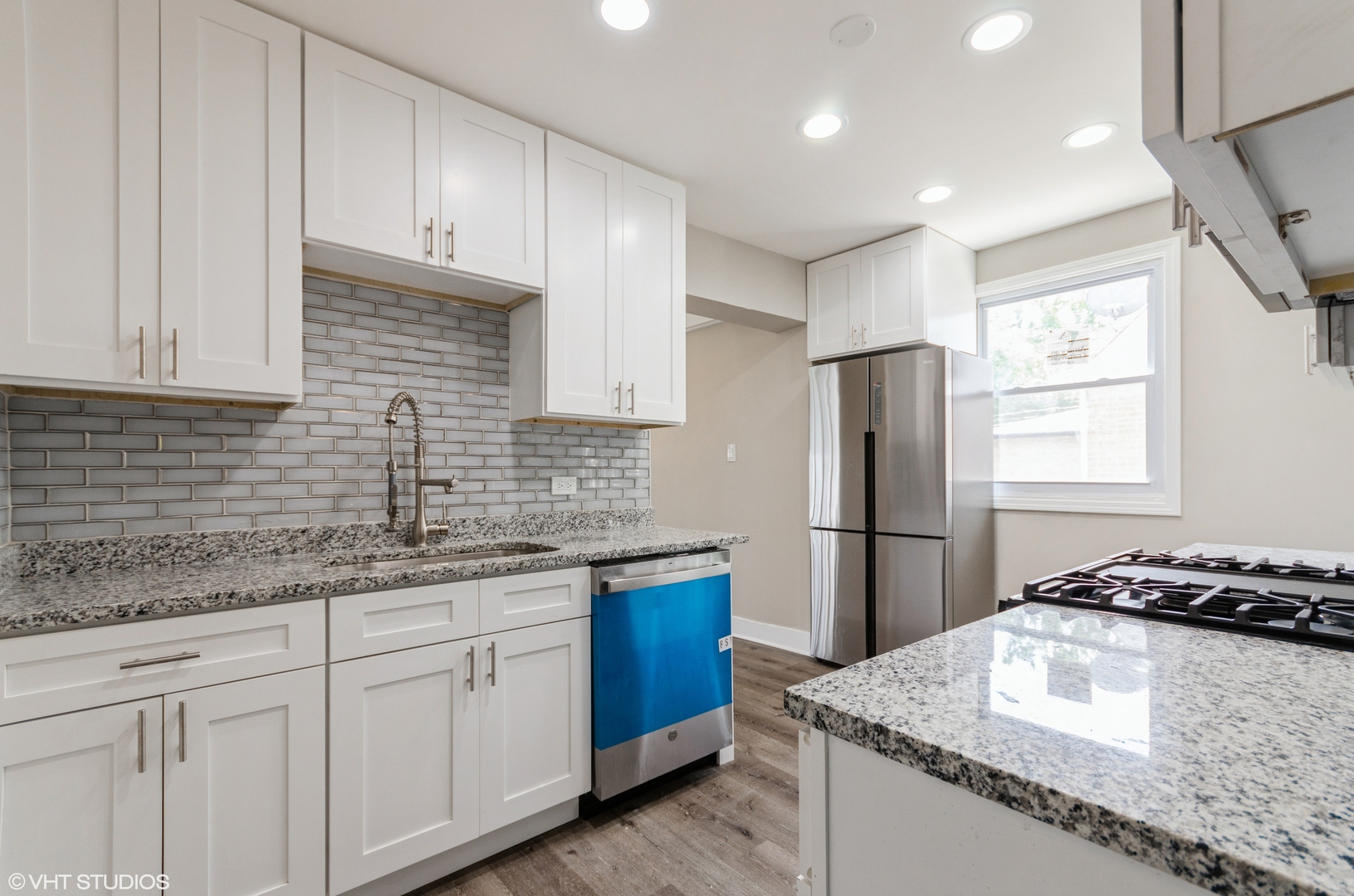 17543 Walter Street Lansing, IL 60438 - Photo 2 of 9 a kitchen with stainless steel appliances granite countertop a sink stove and refrigerator
