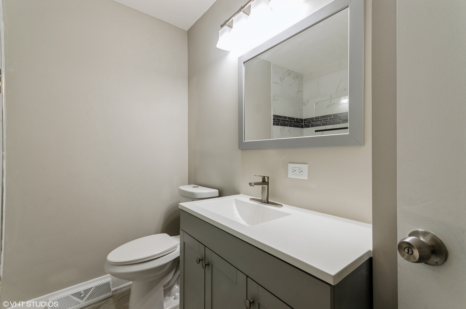 17543 Walter Street Lansing, IL 60438 - Photo 8 of 9 a bathroom with a sink and a toilet