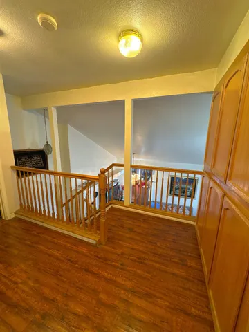 a view of staircase with lots of wooden floor