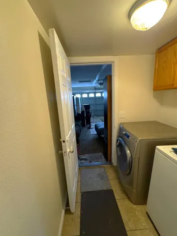 a utility room with a sink a washer and dryer