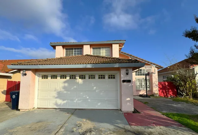 a front view of a house with a garage