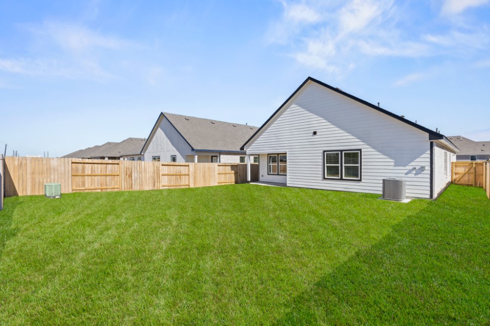 8311 Amber Summit Lane Angleton, TX 77515 - Photo 14 of 14 a view of a house with backyard and garden