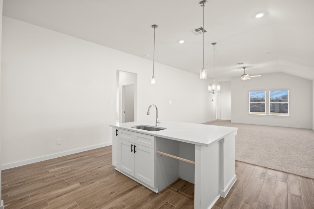 8311 Amber Summit Lane Angleton, TX 77515 - Photo 5 of 14 a view of a kitchen counter space a sink and a window