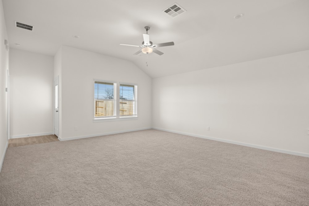 8311 Amber Summit Lane Angleton, TX 77515 - Photo 7 of 14 an empty room with windows and fan