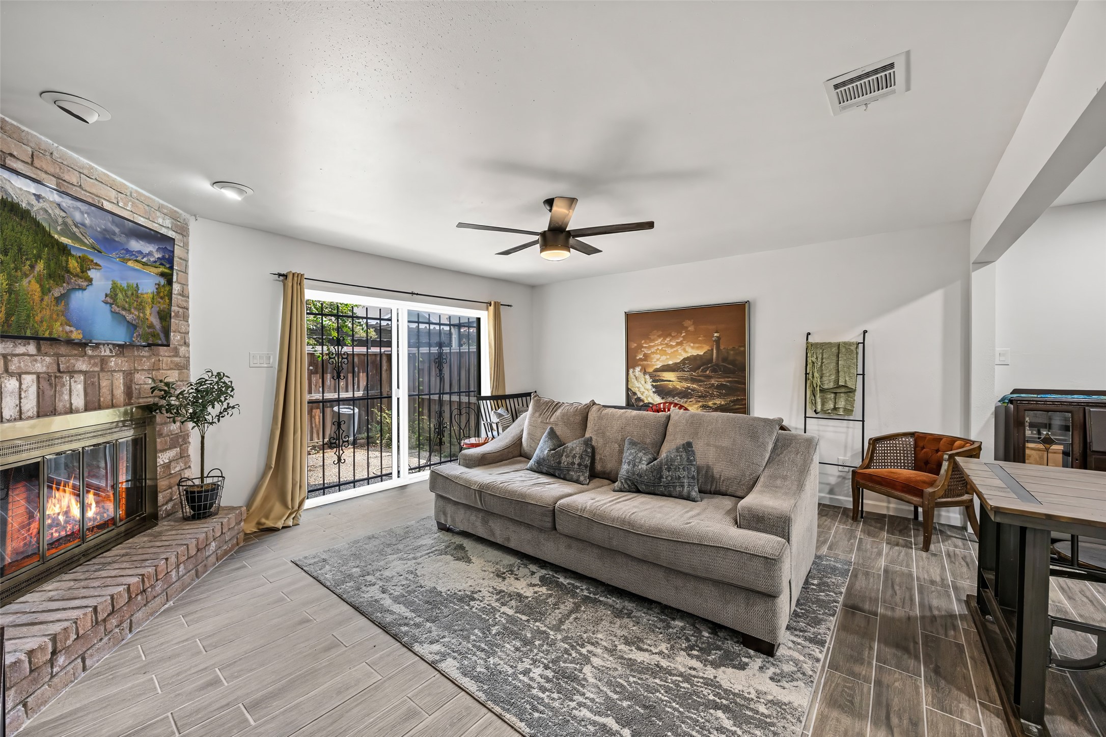 9501 Fondren Road, Unit 9 Houston, TX 77074 - Photo 12 of 29 a living room with furniture and a fireplace