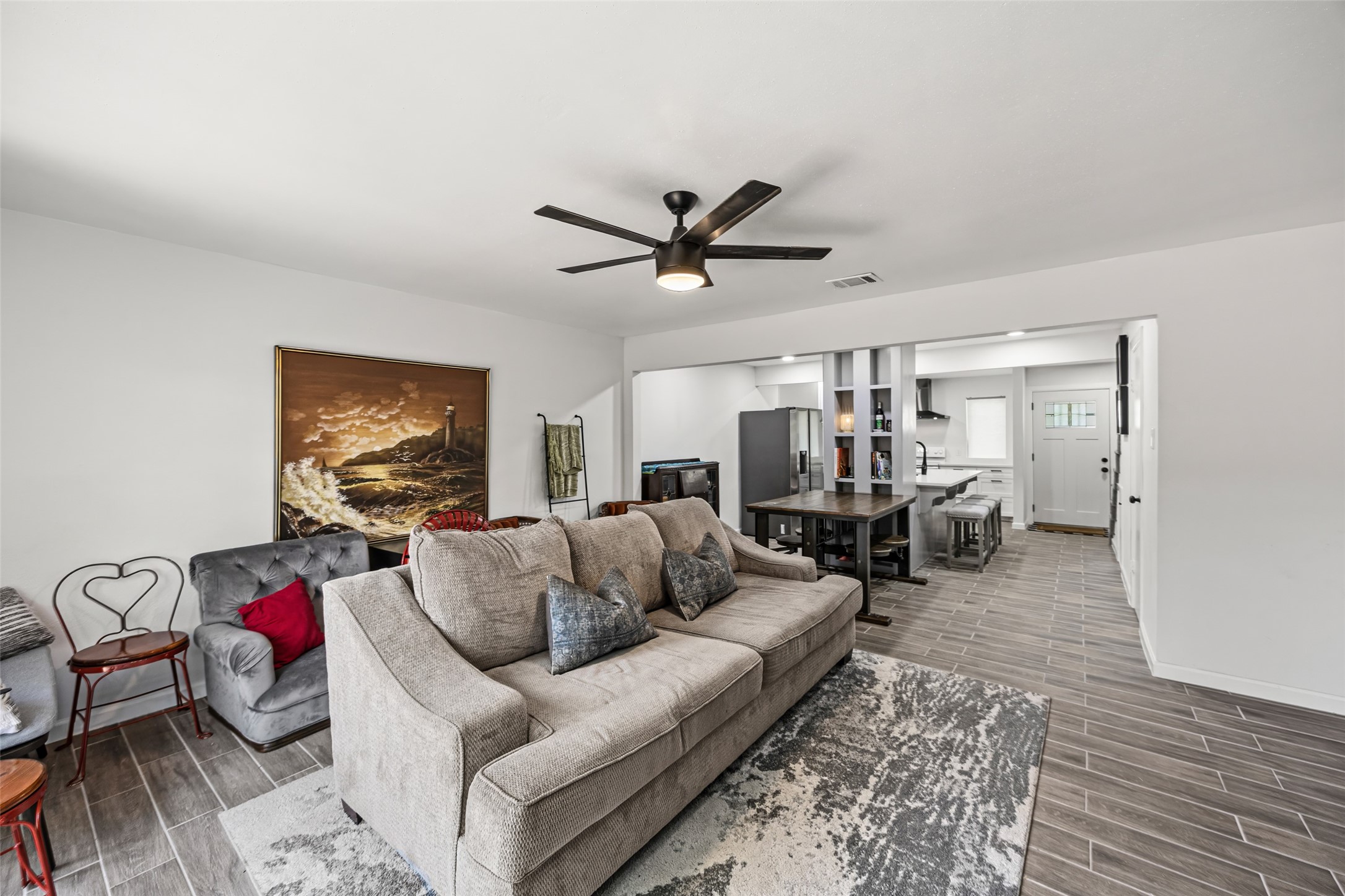 9501 Fondren Road, Unit 9 Houston, TX 77074 - Photo 13 of 29 a living room with furniture a ceiling fan and a rug
