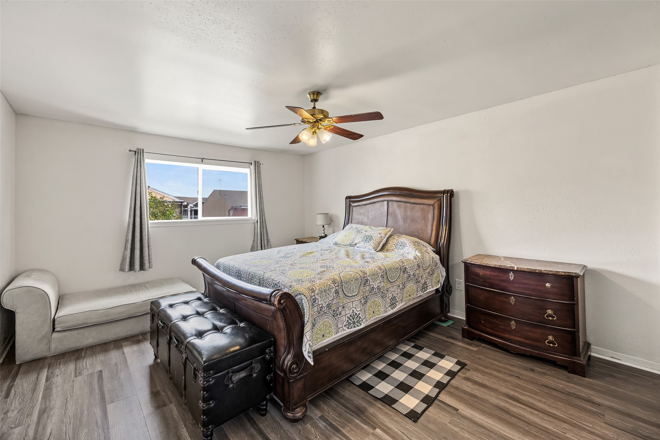 9501 Fondren Road, Unit 9 Houston, TX 77074 - Photo 16 of 29 a bedroom with a bed dresser and a window