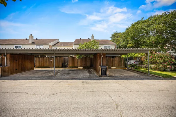 a view of a house with a swimming pool and a yard