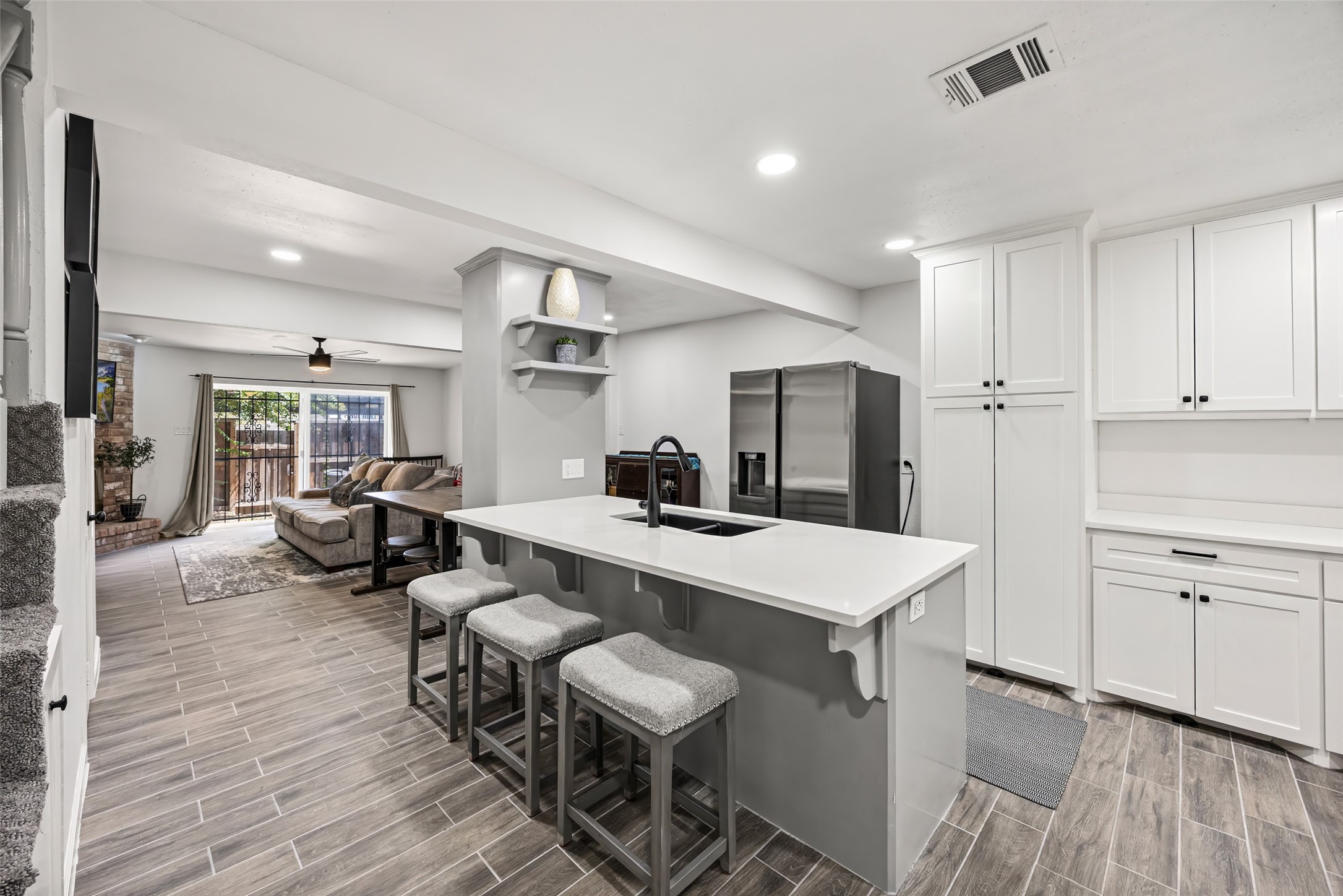 9501 Fondren Road, Unit 9 Houston, TX 77074 - Photo 6 of 29 a large white kitchen with a table and chairs