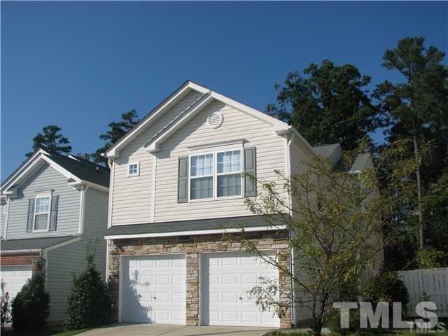 7317 Brighton Hill Lane Raleigh, NC 27616 - Photo 1 of 6 a front view of a house with a yard