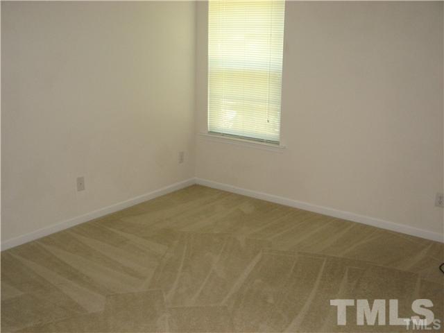 7317 Brighton Hill Lane Raleigh, NC 27616 - Photo 4 of 6 an empty room with a window