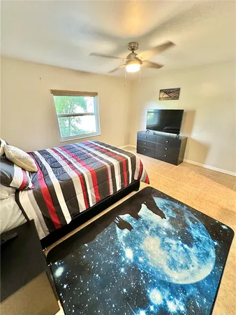 a bedroom with a bed and lamp