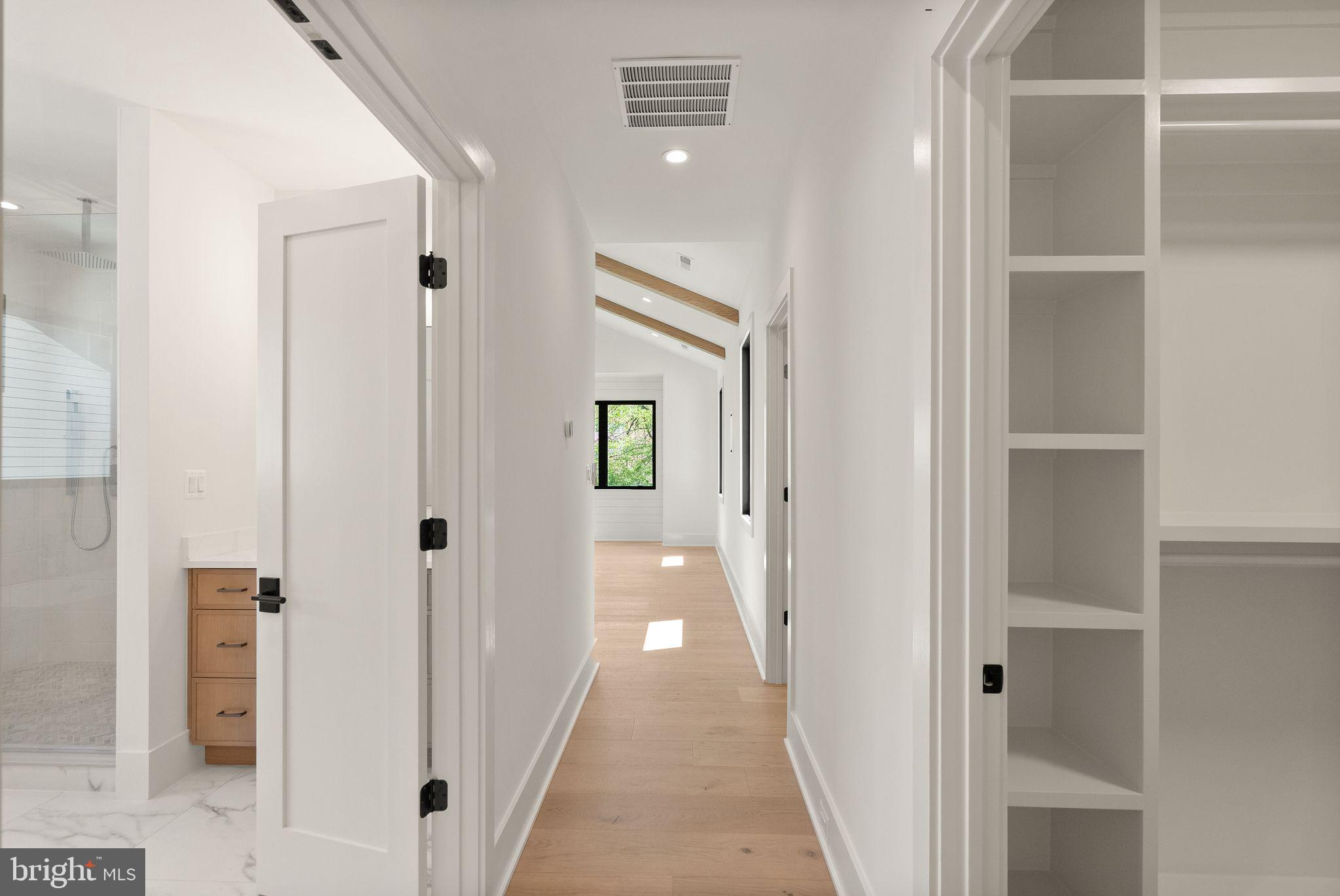 112 Elm Street Southwest Vienna, VA 22180 - Photo 38 of 96 a view of a hallway with wooden floor and closet area