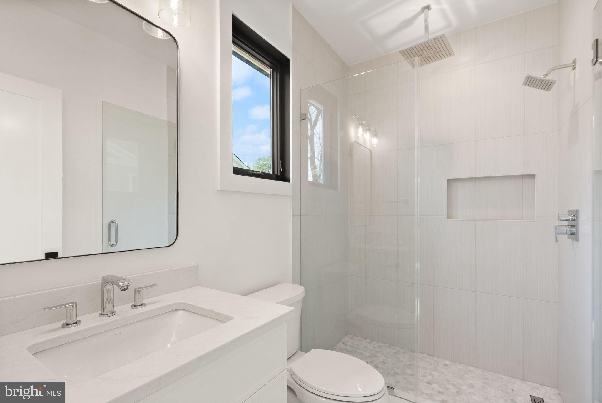112 Elm Street Southwest Vienna, VA 22180 - Photo 47 of 96 a bathroom with a sink a toilet and shower