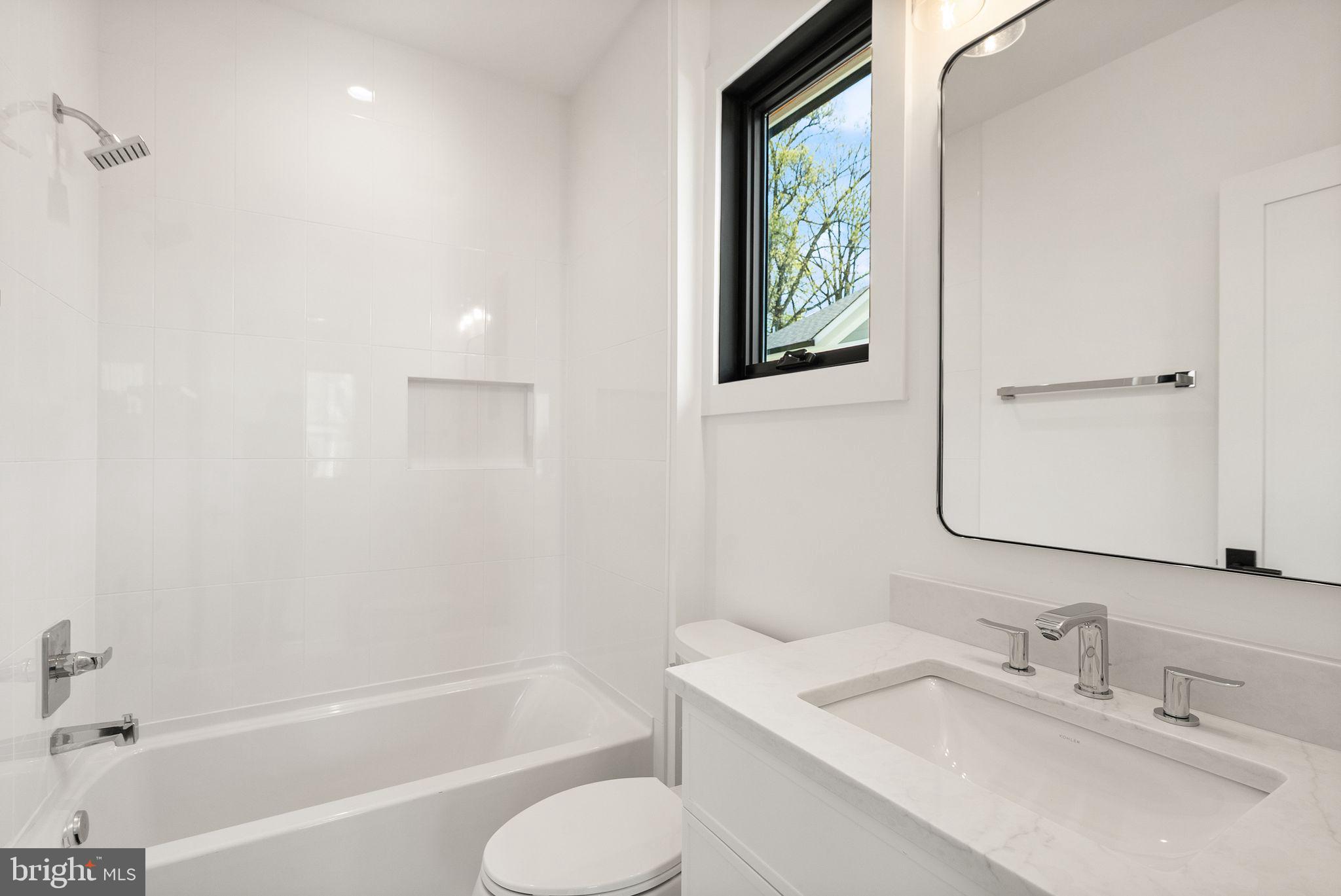 112 Elm Street Southwest Vienna, VA 22180 - Photo 50 of 96 a bathroom with a sink toilet and bathtub