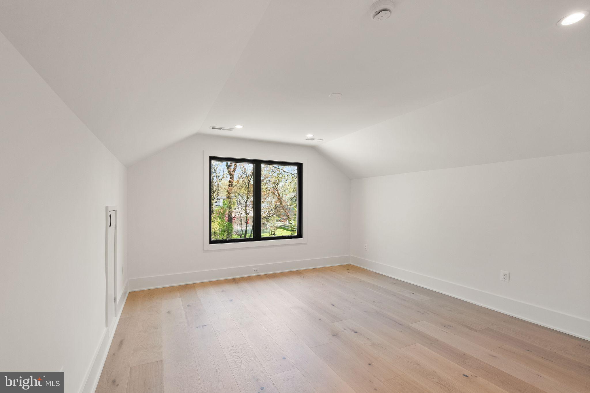 112 Elm Street Southwest Vienna, VA 22180 - Photo 62 of 96 an empty room with wooden floor and windows