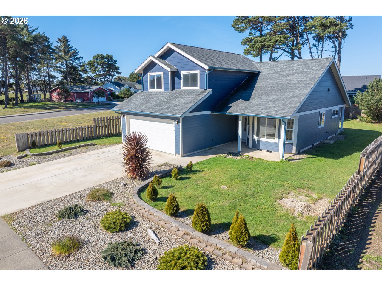 2679 Franklin Avenue Southwest Bandon, OR 97411 - Photo 1 of 48 a house with green field in front of it