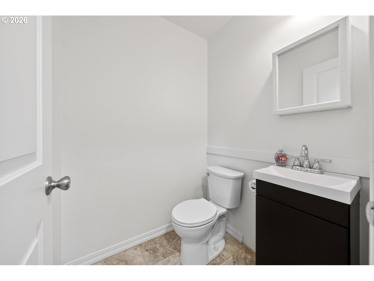2679 Franklin Avenue Southwest Bandon, OR 97411 - Photo 26 of 48 a bathroom with a toilet a sink and mirror