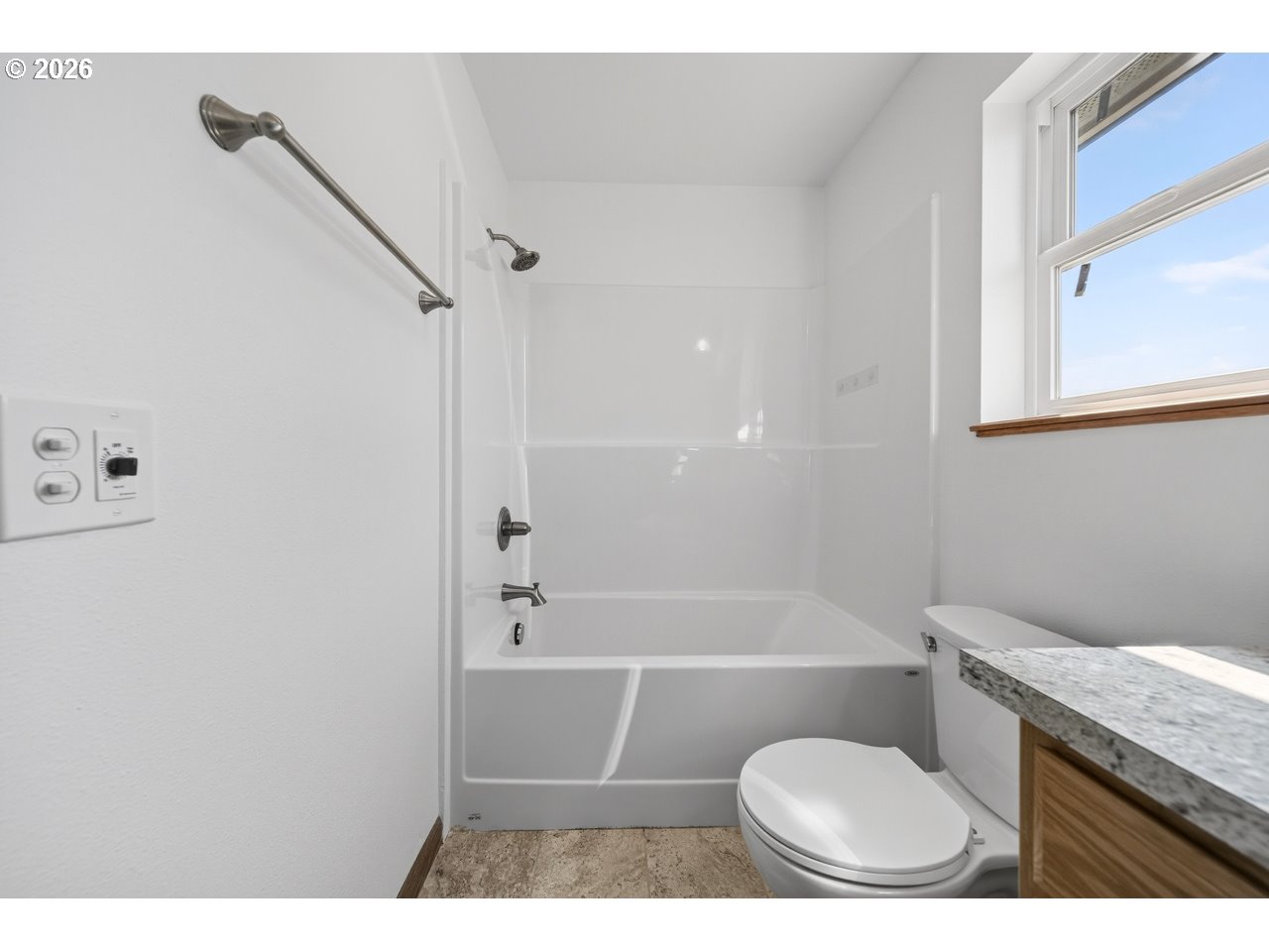 2679 Franklin Avenue Southwest Bandon, OR 97411 - Photo 33 of 48 a bathroom with a granite countertop toilet sink and shower
