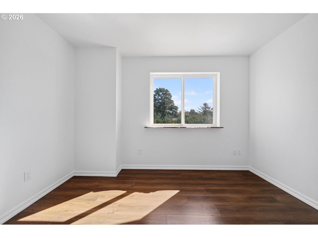 2679 Franklin Avenue Southwest Bandon, OR 97411 - Photo 36 of 48 a view of an empty room with wooden floor and closet