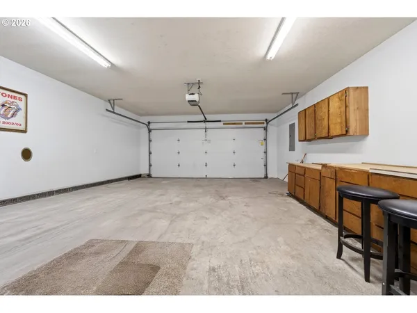 a kitchen with a sink cabinets and wooden floor