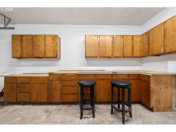 a living room with furniture and a ceiling fan