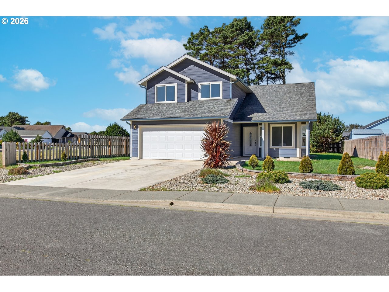 2679 Franklin Avenue Southwest Bandon, OR 97411 - Photo 4 of 48 a front view of a house with a yard