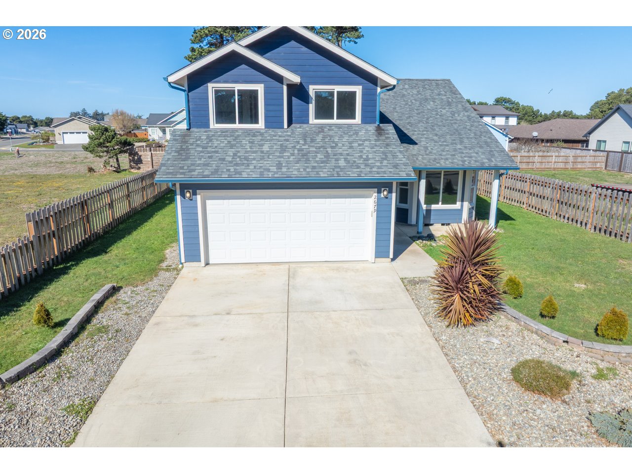2679 Franklin Avenue Southwest Bandon, OR 97411 - Photo 42 of 48 a front view of a house with garden