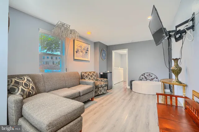 a living room with furniture and a window