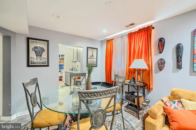a view of a dining room with furniture and a window