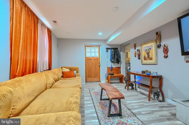 a living room with furniture and a window