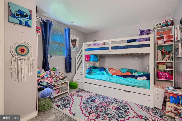 a bed room with a bed and a couch