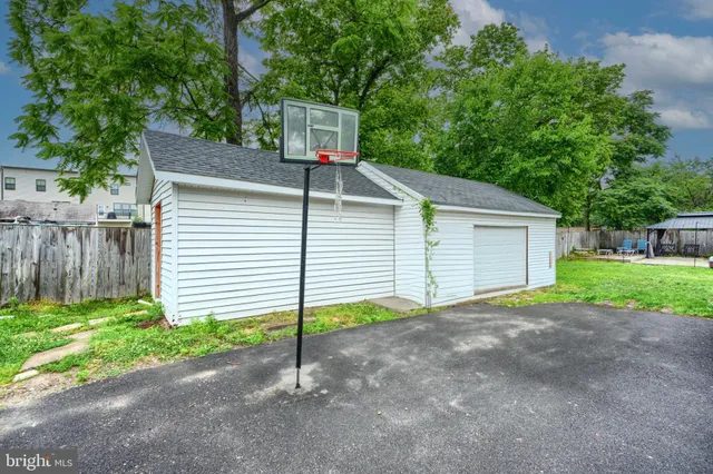 a view of a house with a yard and garage