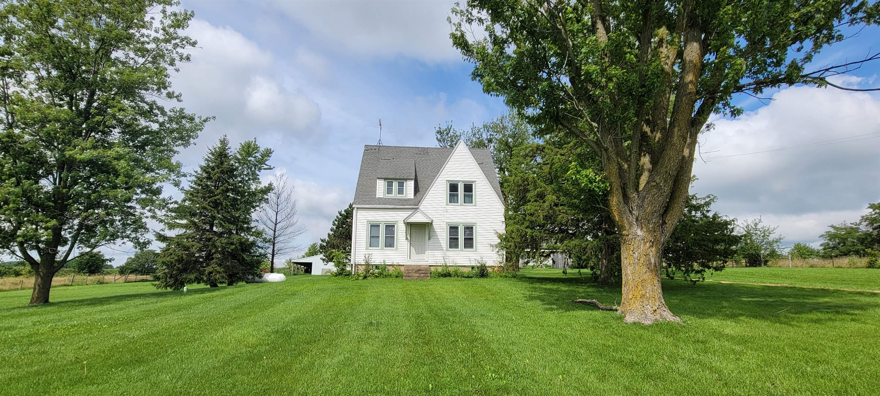 1966 North Heitter Road Lena, IL 61048 - Photo 1 of 27 a view of a house with a big yard